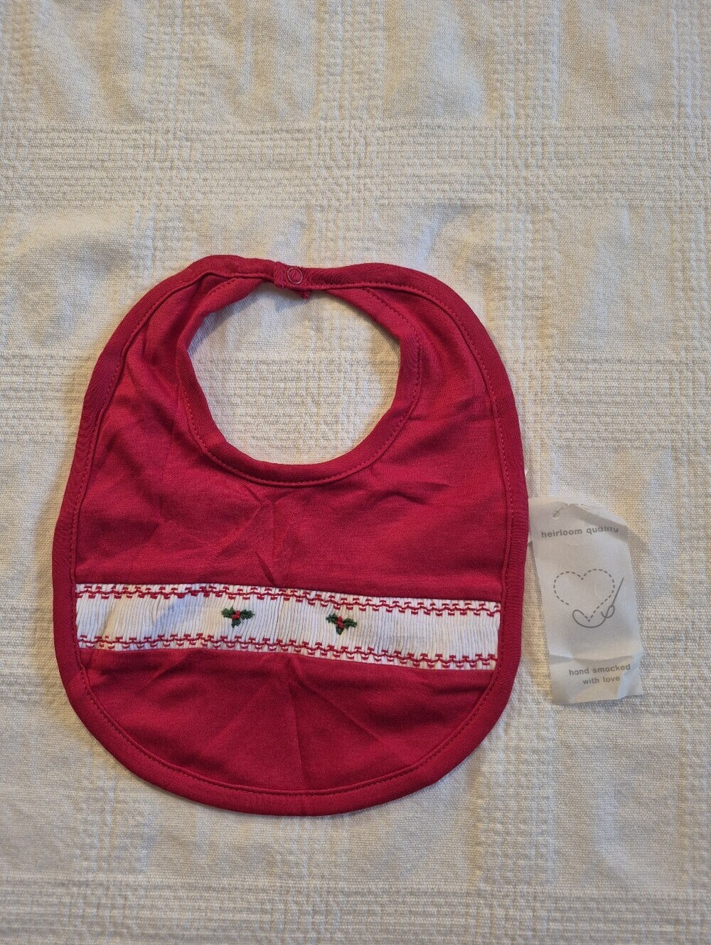 Kissy Kissy Premier 1 size baby hand smocked red holiday holly bib NWT